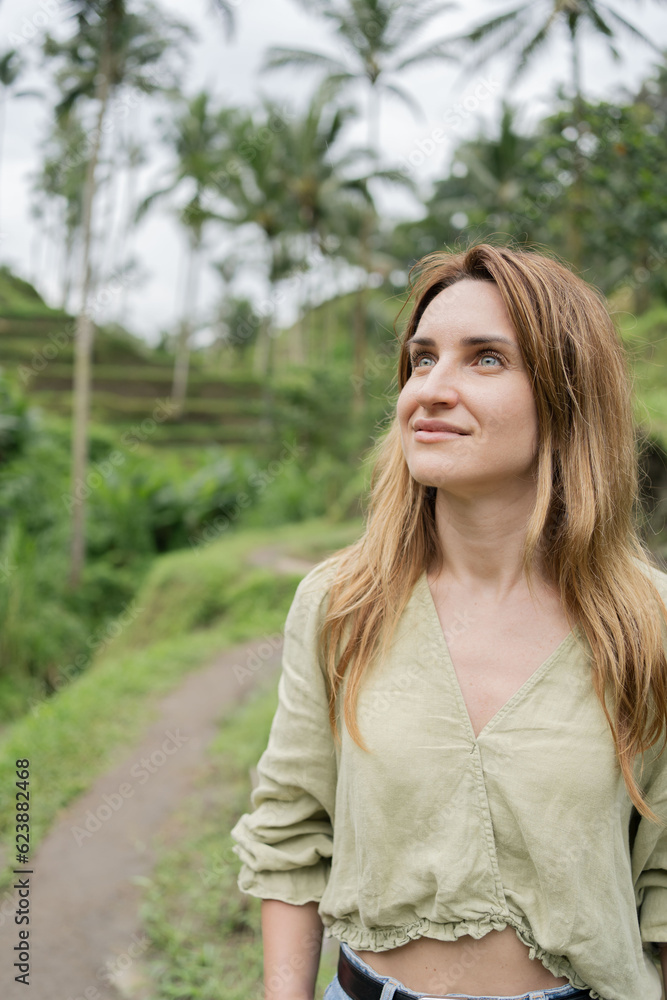 woman travelling in Asia, walking in rice paddies in Bali, freedom feeling, explore. woman travelling in Asia, walking in rice paddies in Bali, freedom feeling, explore.