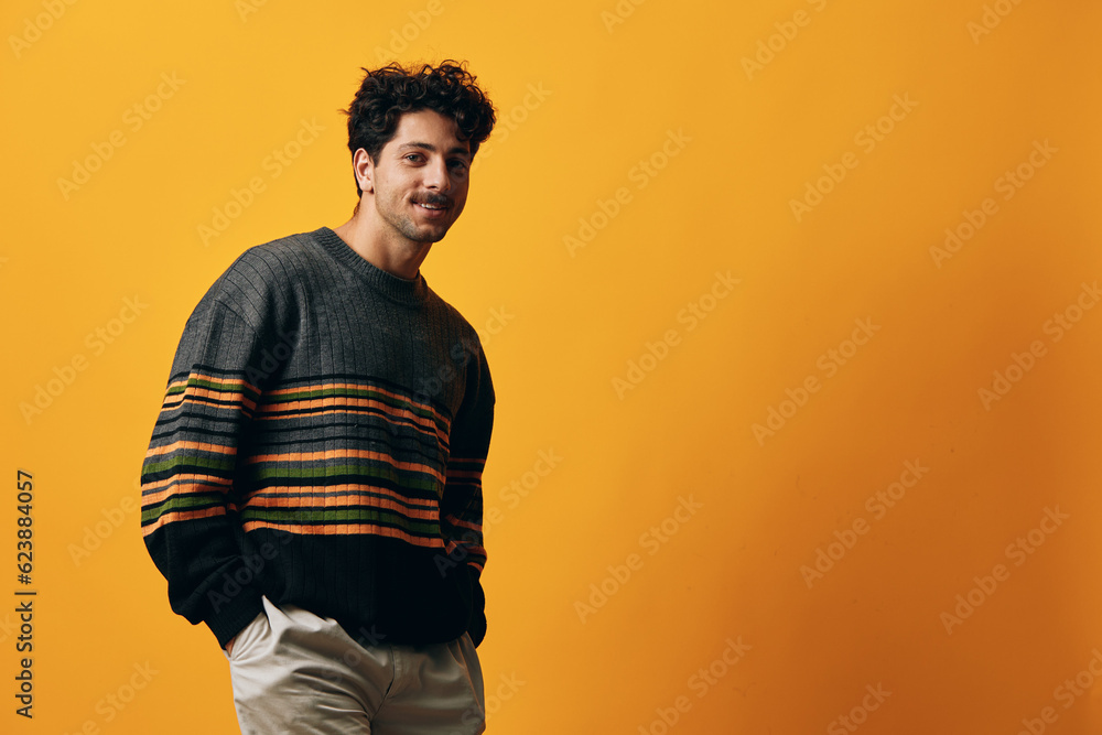 Man trendy portrait fashion orange sweater background Man trendy portrait fashion orange sweater background