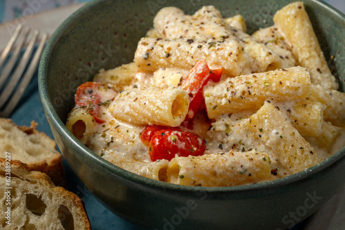 Rigatoni pasta with cherry tomatos and ricotta sauce.