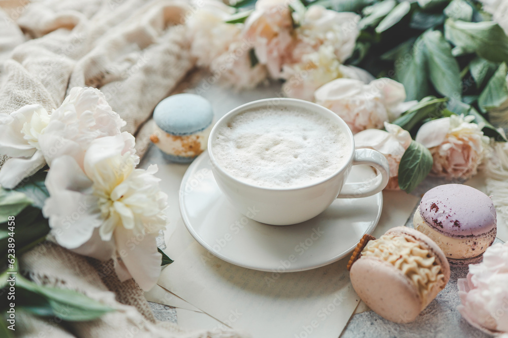 Cup of coffee, sweet macaroons and white peonies, beautiful aesthetic photo Cup of coffee, sweet macaroons and white peonies, beautiful aesthetic photo