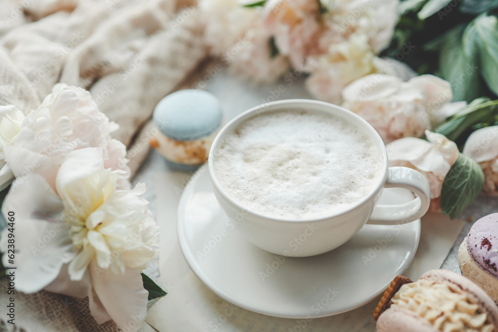 Cup of coffee, sweet macaroons and white peonies, beautiful aesthetic photo Cup of coffee, sweet macaroons and white peonies, beautiful aesthetic photo
