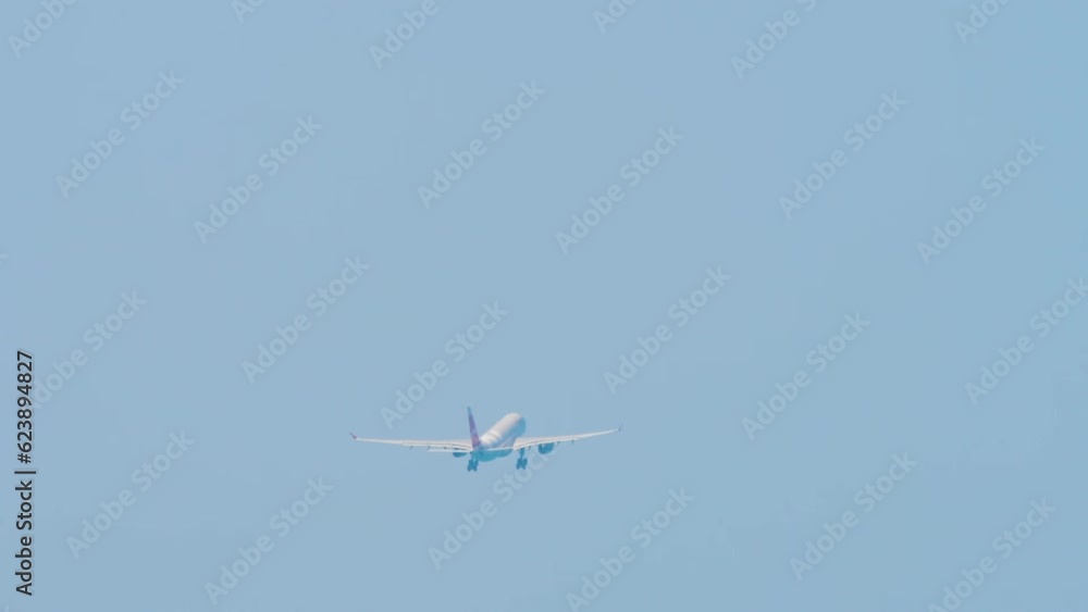 Passenger wide body airplane take off and climbing at Sochi airport, rear view. Airplane leaving Passenger wide body airplane take off and climbing at Sochi airport, rear view. Airplane leaving