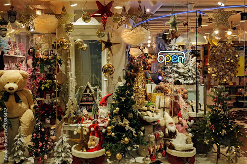 Christmas and New Year holidays storefront decorations through the glass