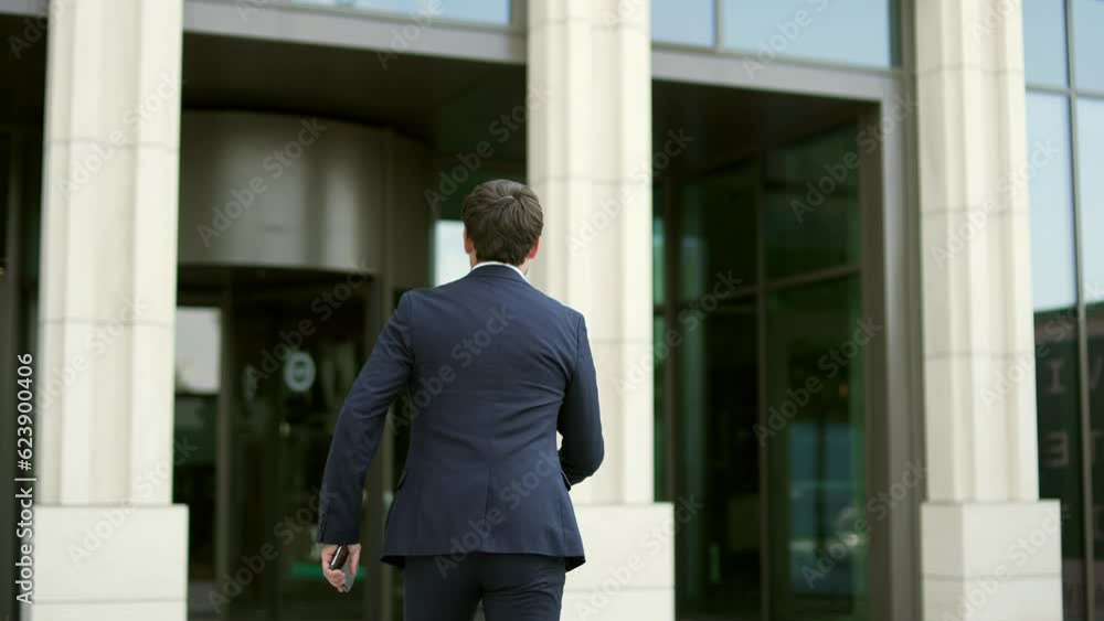 Man rushes to work. Late business meeting. Worried businessman on the way to office. Male in suit in hurry running Deadline. Time management. Busy Lifestyle rear back view from behindin rush Man rushes to work. Late business meeting. Worried businessman on the way to office. Male in suit in hurry running Deadline. Time management. Busy Lifestyle rear back view from behindin rush