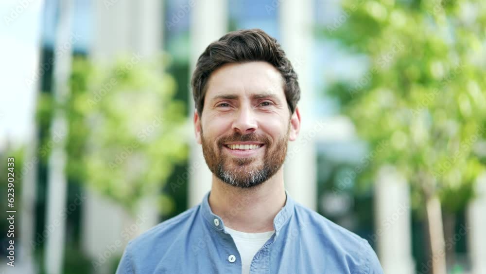 Headshot Portrait confident mature adult handsome businessman man in casual look at camera smile. Happy business male employee, entrepreneur, freelancer near office building a city street outside Headshot Portrait confident mature adult handsome businessman man in casual look at camera smile. Happy business male employee, entrepreneur, freelancer near office building a city street outside