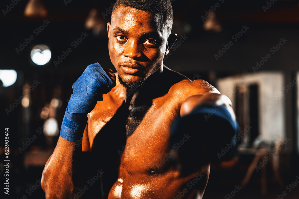 Boxing fighter shirtless posing, African American Black boxer punch his