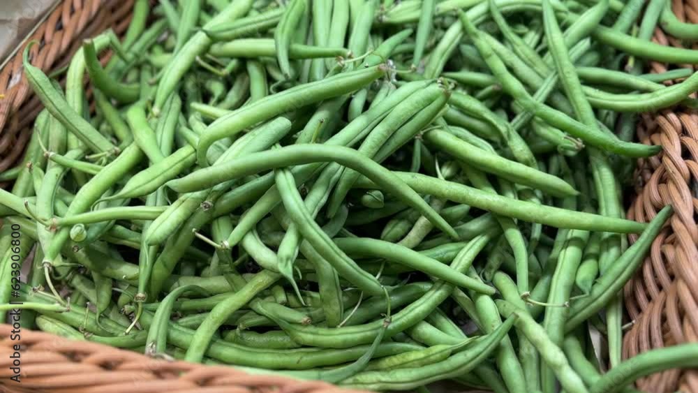Asparagus beans close-up in a shopping cart at a grocery store. Asparagus beans close-up in a shopping cart at a grocery store.