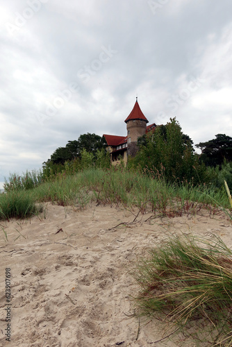 A view of historic hotel building on sand dune, Leba beach, Baltic Sea, Poland