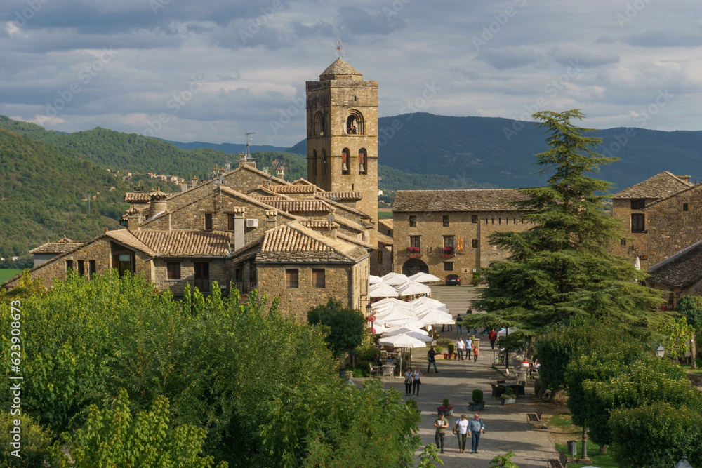 Old church at the town square in the medieval village of Ainsa in the pyrenees, Aragon, Spain