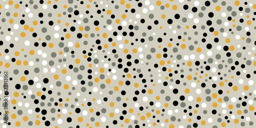 Dots on a gray background. Vector pattern of dots scattered over the surface. For prints and seamless coverings such as wallpapers, cushions, packaging. Black, yellow and gray dots.