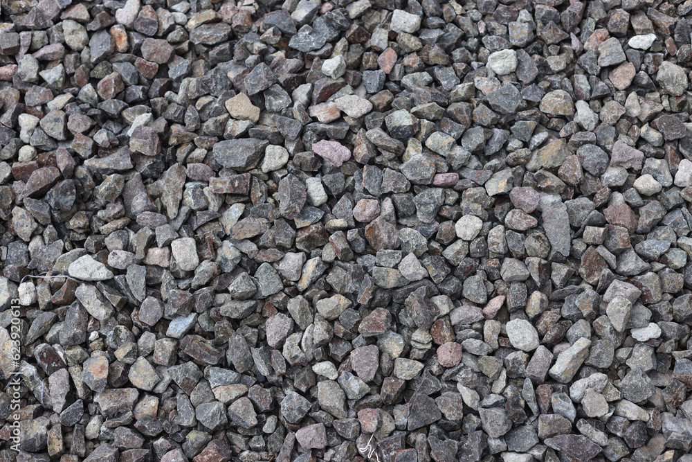 Gravel texture background. Pebble sea beach close-up, dark wet pebble and gray dry pebble. Gravel texture background. Pebble sea beach close-up, dark wet pebble and gray dry pebble.