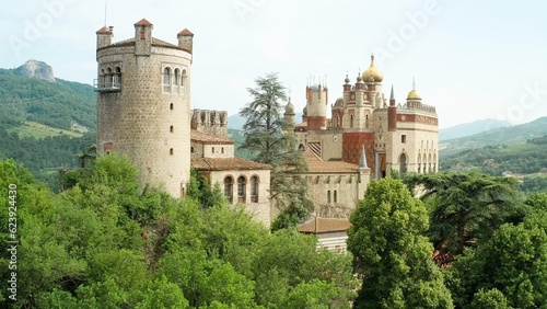 Aerial drone panoramic view of the Rocchetta Mattei castle in Italy on sunny summer day, view from above. 