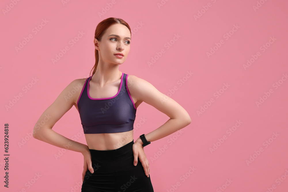 Young woman in sportswear on pink background, space for text Young woman in sportswear on pink background, space for text