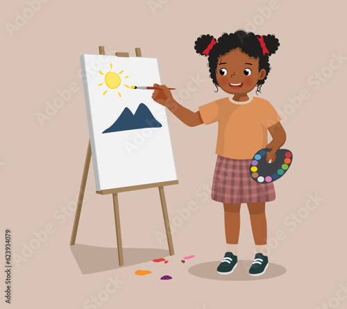 little African girl painting on canvas with color palette and paintbrush 