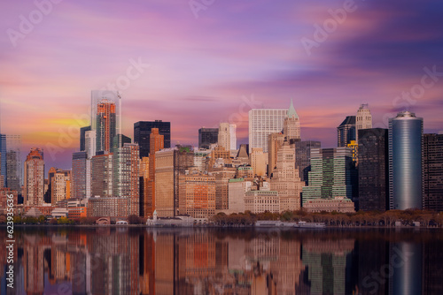 New York City Manhattan downtown skyline at dusk with skyscrapers over Hudson River,