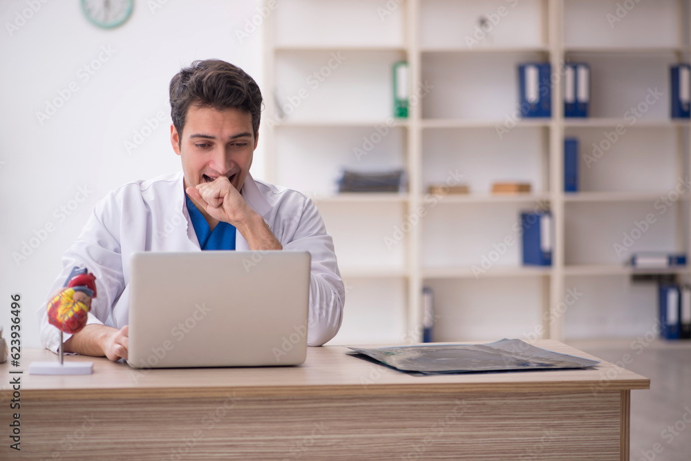 Young male doctor in telemedicine concept Young male doctor in telemedicine concept