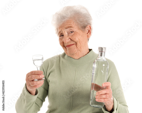 Senior woman with glass and...