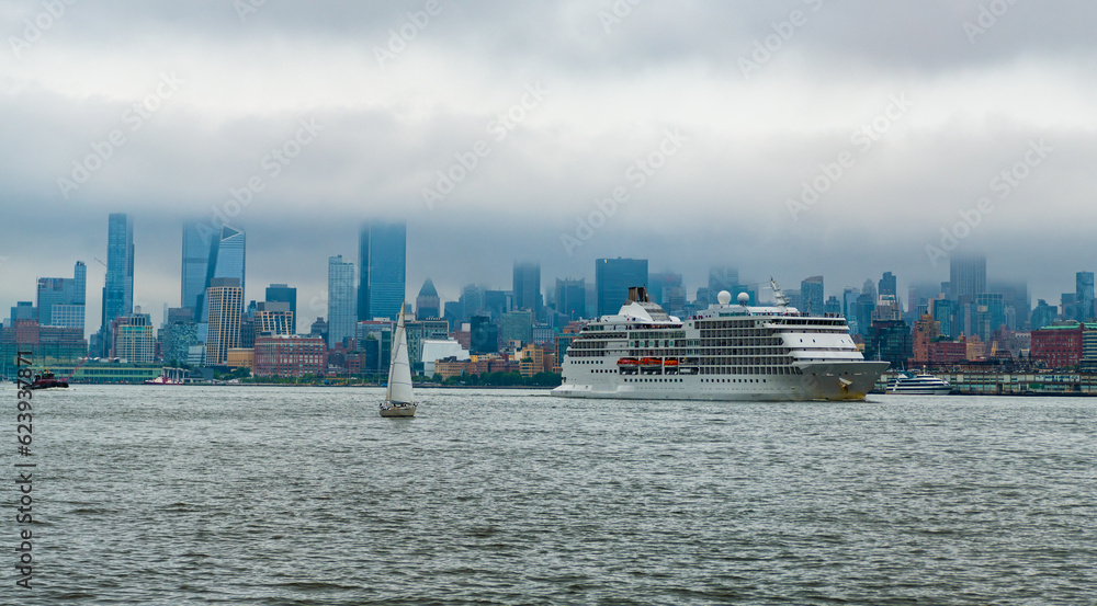 Cruise ship Regent Navigator sailing next Manhattan in New York. Skyline of New York Manhattan cruising on the Hudson River cruise liner . Vacation on cruise liner.