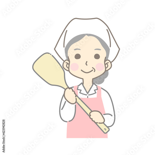 大きいヘラを持つ調理スタッフの女性（給食センター・食堂・厨房・食品加工）