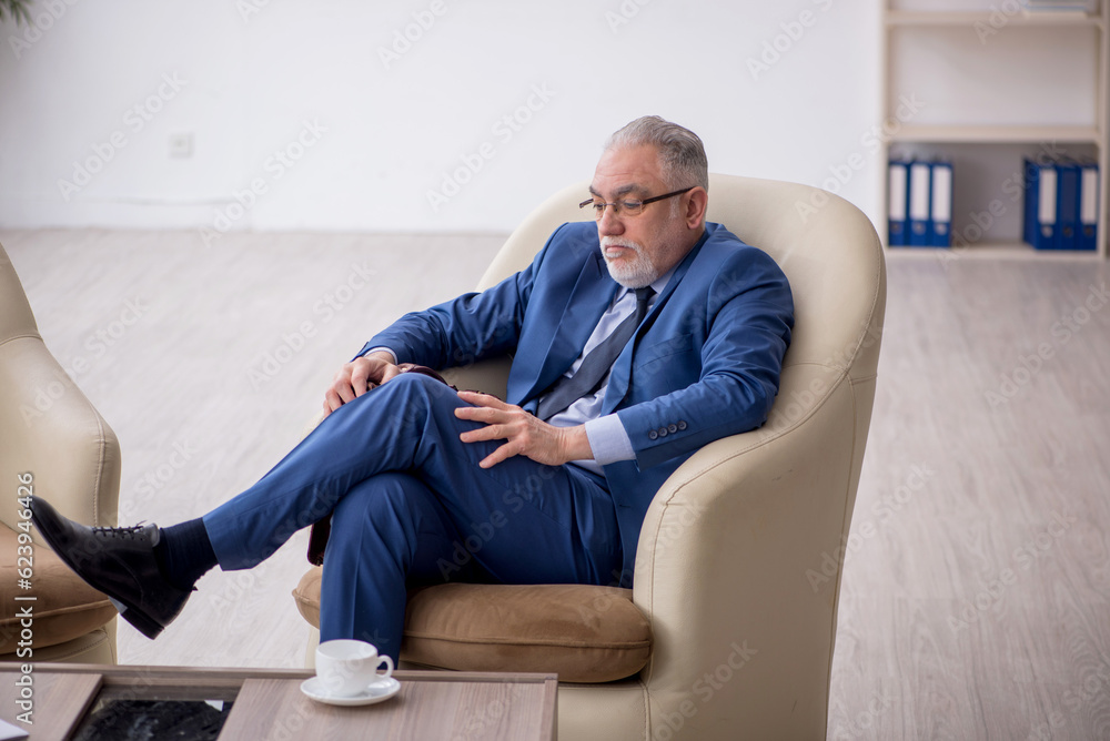 Old businessman waiting for business meeting Old businessman waiting for business meeting