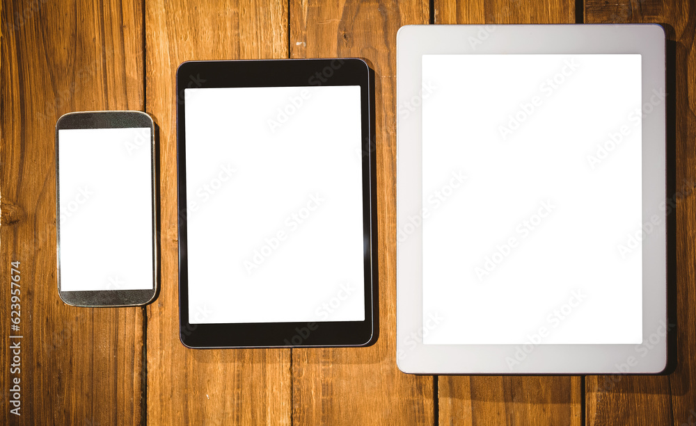 Digital png illustration of smartphone and tablets on wood on transparent background Digital png illustration of smartphone and tablets on wood on transparent background