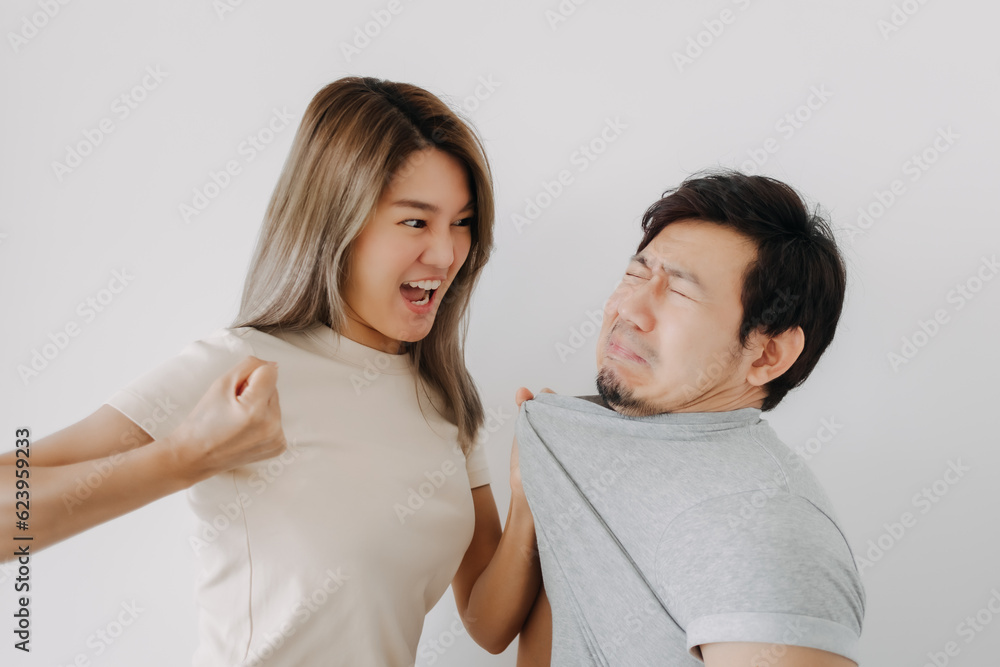 Domestic violence of asian wife hitting husband isolated on white. Domestic violence of asian wife hitting husband isolated on white.