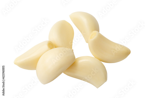 Peeled garlic cloves in stack isolated on white background with clipping path.
