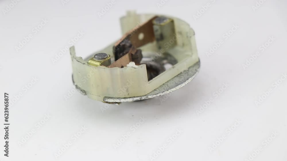 Carbon brush part of a dc motor. Electric conductive carbon brushes for rotating the rotor shaft of electric motor Carbon brush part of a dc motor. Electric conductive carbon brushes for rotating the rotor shaft of electric motor