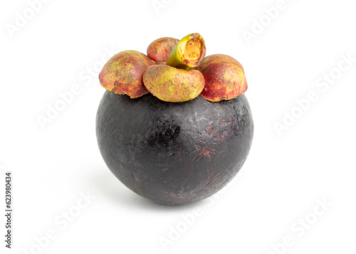 close up of single raw fresh and ripe mangosteen fruit isolated on white background