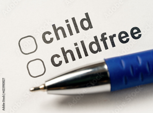 Child or Childfree checkbox on white paper with blue pen. Questionnaire for parents. Form of marital status, Questionnaire do you want to have children. Answer is in checklist test. photo
