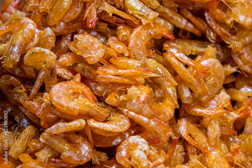 Close up of dried shrimps. Seafood background. Top view.