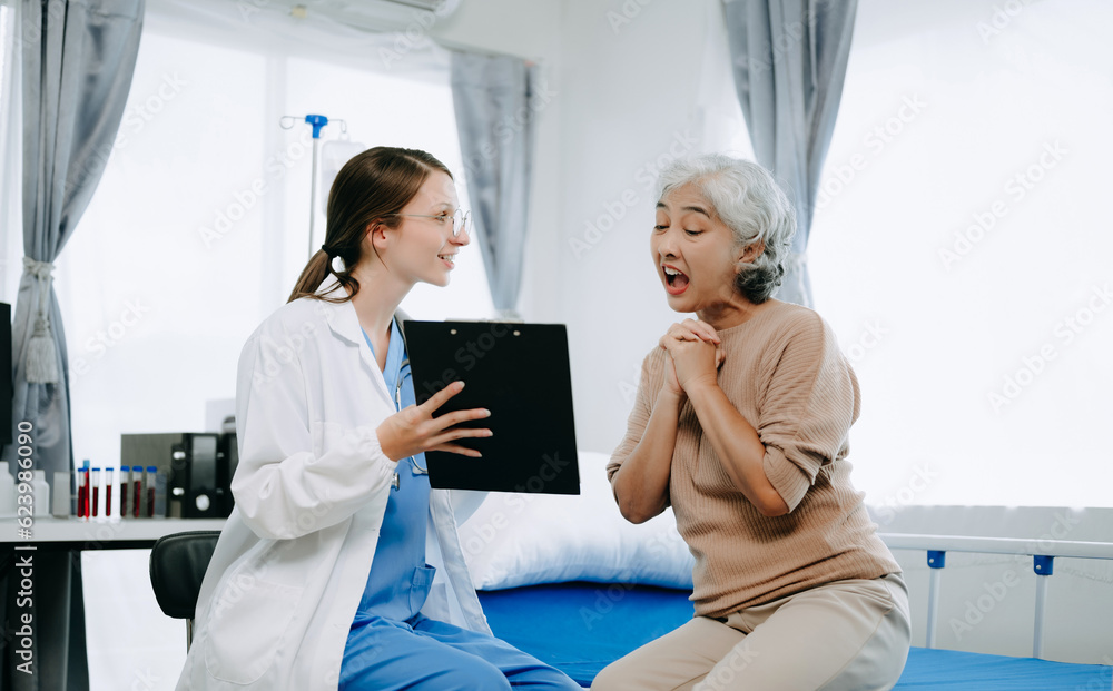 Fototapeta premium Caucasian doctor smiling take care of a young patient in hospital. Friendly nurse or therapeutic treat client Professional medical service concept.