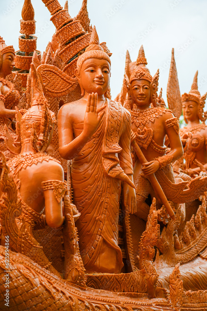 Fototapeta premium Art of candle decoration to celebrate in candle festival in The End of Buddhist Lent in Ubon Ratchathani, Thailand held on July 14, 2022