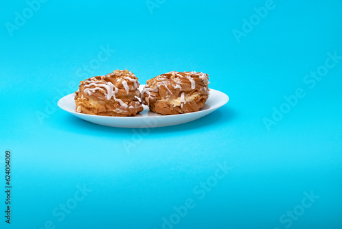 Food, donuts, sweets, custard, on a clean background, blue, banner, peach, pastries, decorative pastries, sweet, tasty, on a plate, on a plate