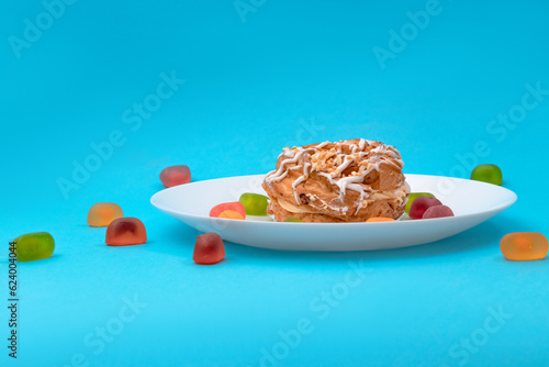 Food, donuts, sweets, custard, on a clean background, blue, banner, peach, pastries, decorative pastries, sweet, tasty, on a plate, on a plate