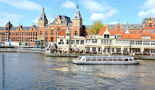 view of the old city, beautiful canal in the Amsterdam city with ferry in harbor, Amsterdam, north Holland , Netherlands,