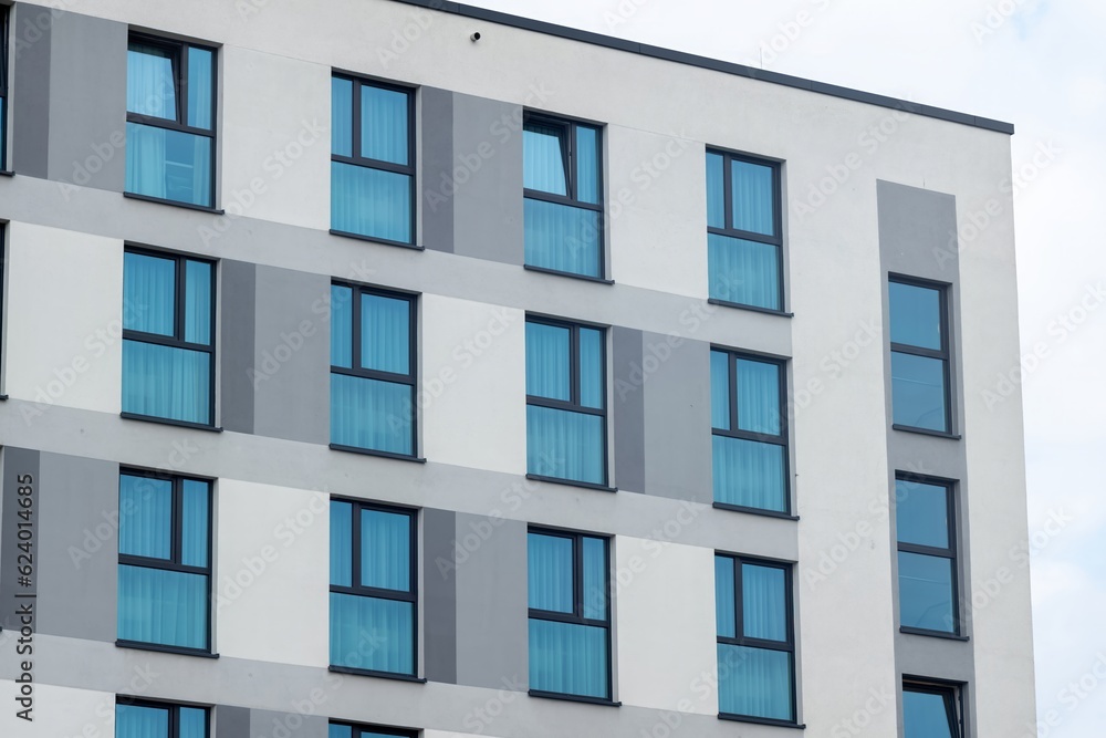 facade of a modern office building with many windows facade of a modern office building with many windows