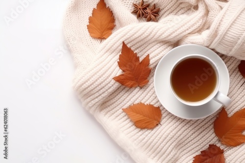 Cup of fresh hot tea with milk with autumn leaves and plaid, top view flat lay, AI Generated