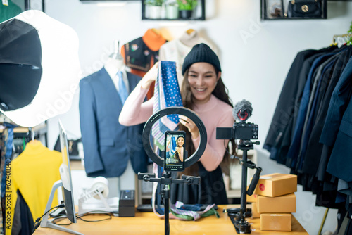 Asia blogger or Vlogger live streaming reviewing product on Business online influencer on social media, Content creator concept.