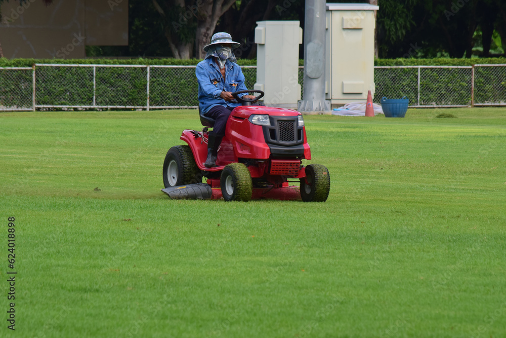 On the football field there is a lawn mower. On the football field there is a lawn mower.
