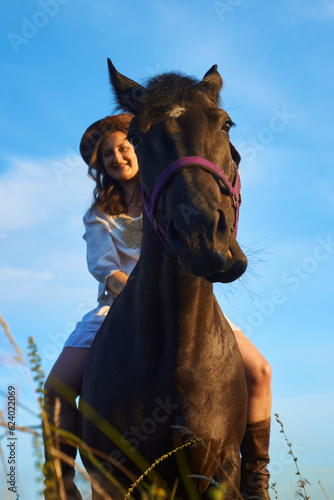 Funny horse with girl on him