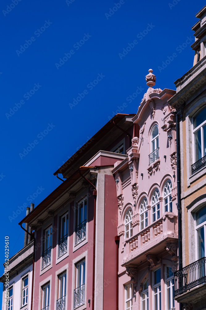 facade of pink building in downtown Porto Portugal