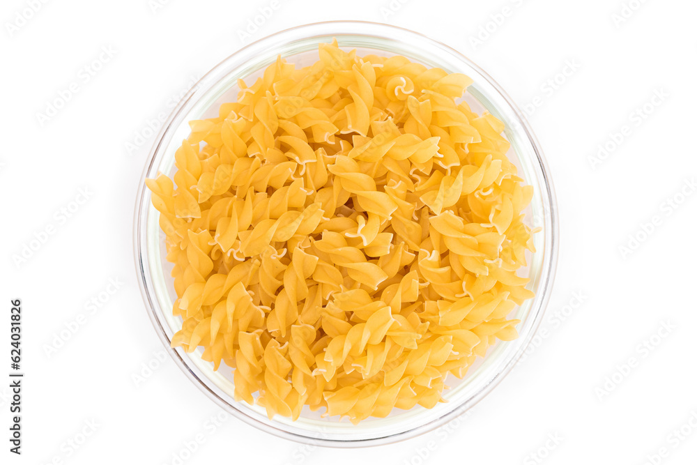Uncooked Fusilli Pasta in Glass Jar Isolated on White Background. Fat and Unhealthy Food. Classic Dry Spiral Macaroni. Italian Culture and Cuisine. Raw Pasta Uncooked Fusilli Pasta in Glass Jar Isolated on White Background. Fat and Unhealthy Food. Classic Dry Spiral Macaroni. Italian Culture and Cuisine. Raw Pasta