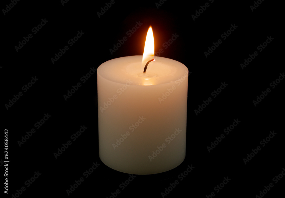 Burning white candle isolated on black background. Burning white candle isolated on black background.