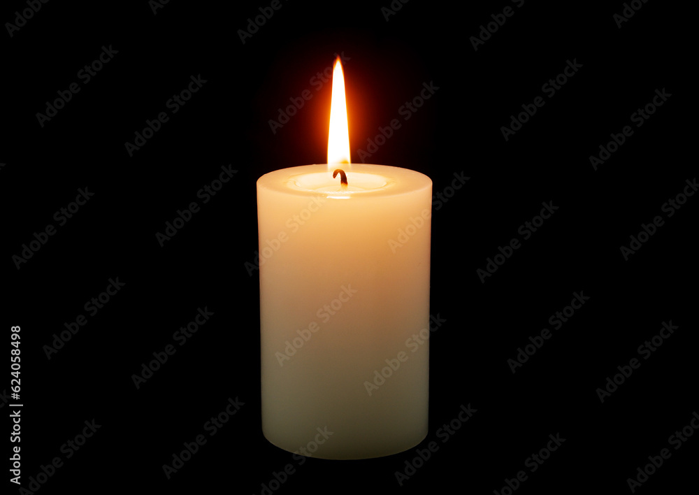 White candle burning on black background. White candle burning on black background.