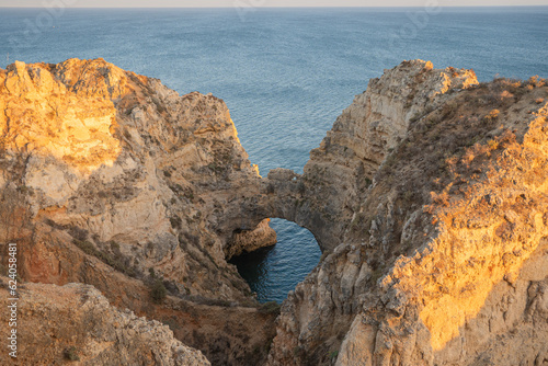 Arche and caves at sunset from tall cliffs from ponta da piedade in Lagoa-Algarve-Portugal.