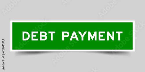Sticker label with word debt payment in green color on gray background
