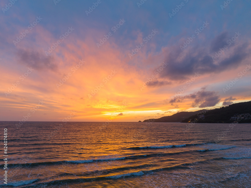 The sky changes color from yellow to red as the sun sets over the sea..sunset landscape amazing light of nature cloudscape sky. .Big sun and red lighting sky background. 4k resolution