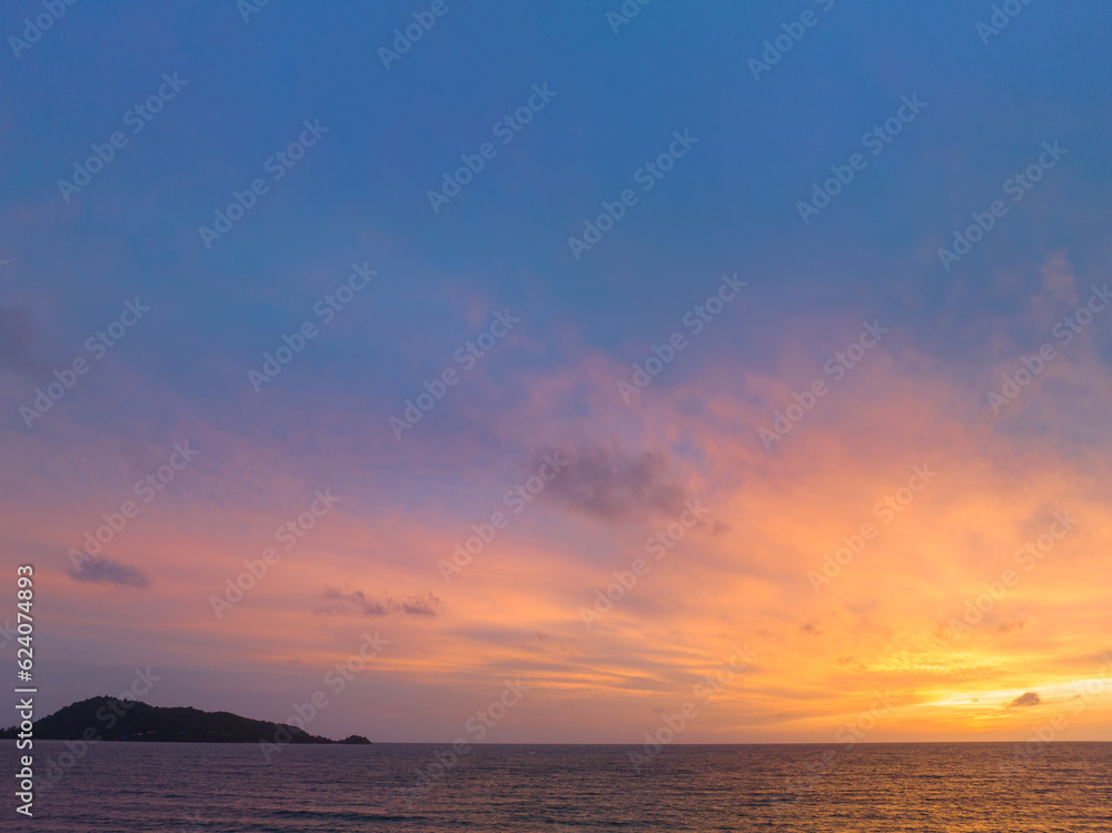 The sky changes color from yellow to red as the sun sets over the sea..sunset landscape amazing light of nature cloudscape sky. .Big sun and red lighting sky background. 4k resolution The sky changes color from yellow to red as the sun sets over the sea..sunset landscape amazing light of nature cloudscape sky. .Big sun and red lighting sky background. 4k resolution