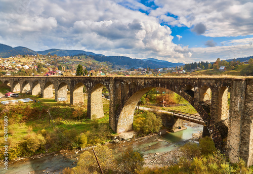 The old Austrian operating railway viaduct in the resort village of Vorokhta. Ukraine.